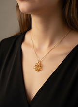 Citrine Parol Necklace worn by a person in a black top.
